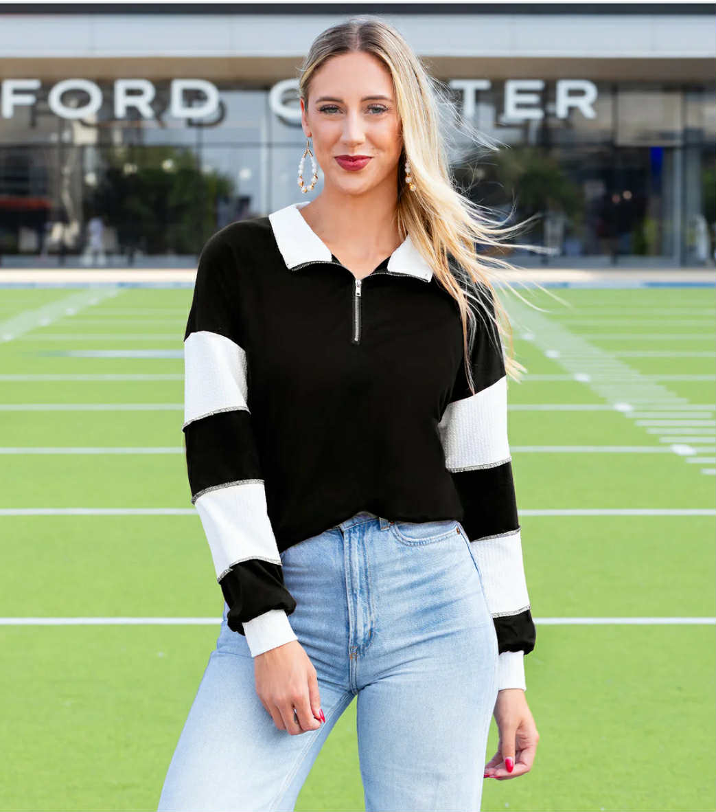 Black and white long sleeve half zip pullover top